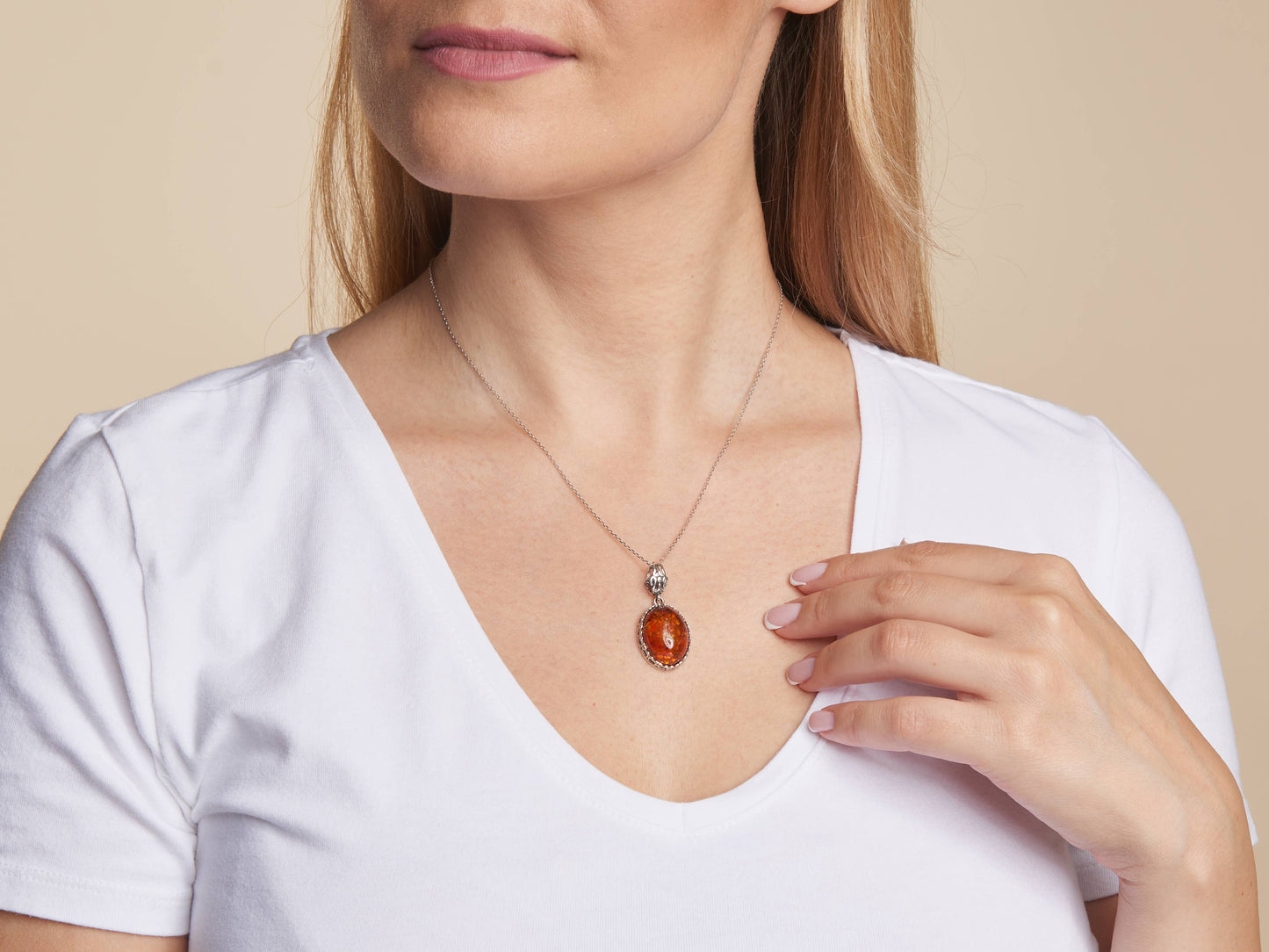 Oval cognac amber pendant, antique silver 925, 2+1 cm