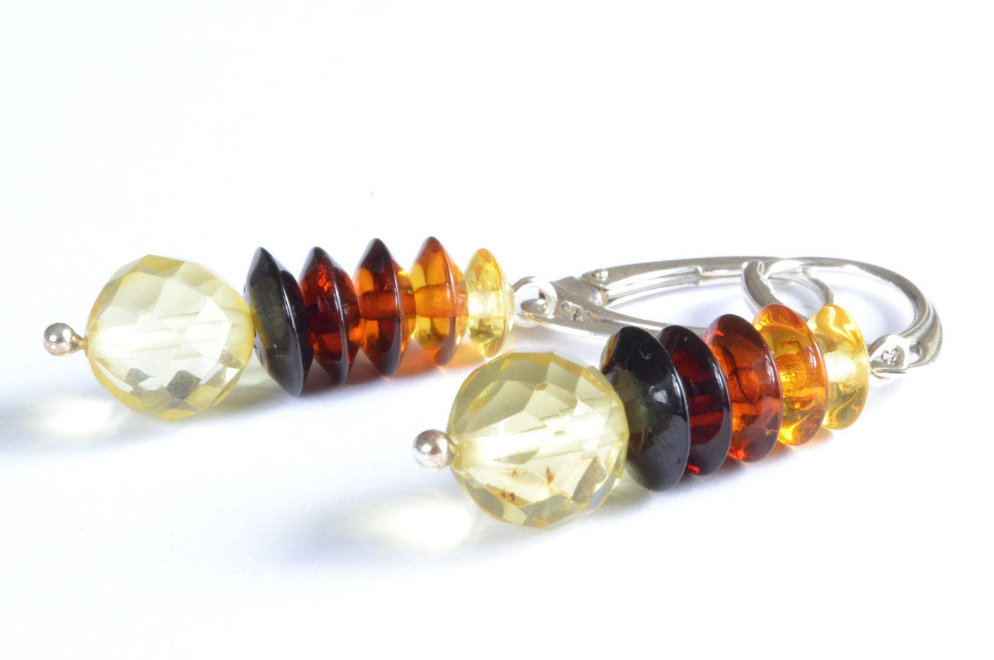 Multicolored faceted Baltic amber beads in drop shape