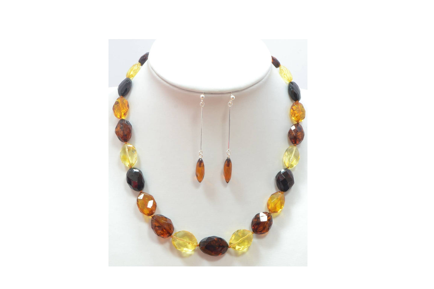 Large faceted set of multicolored amber in olive shape