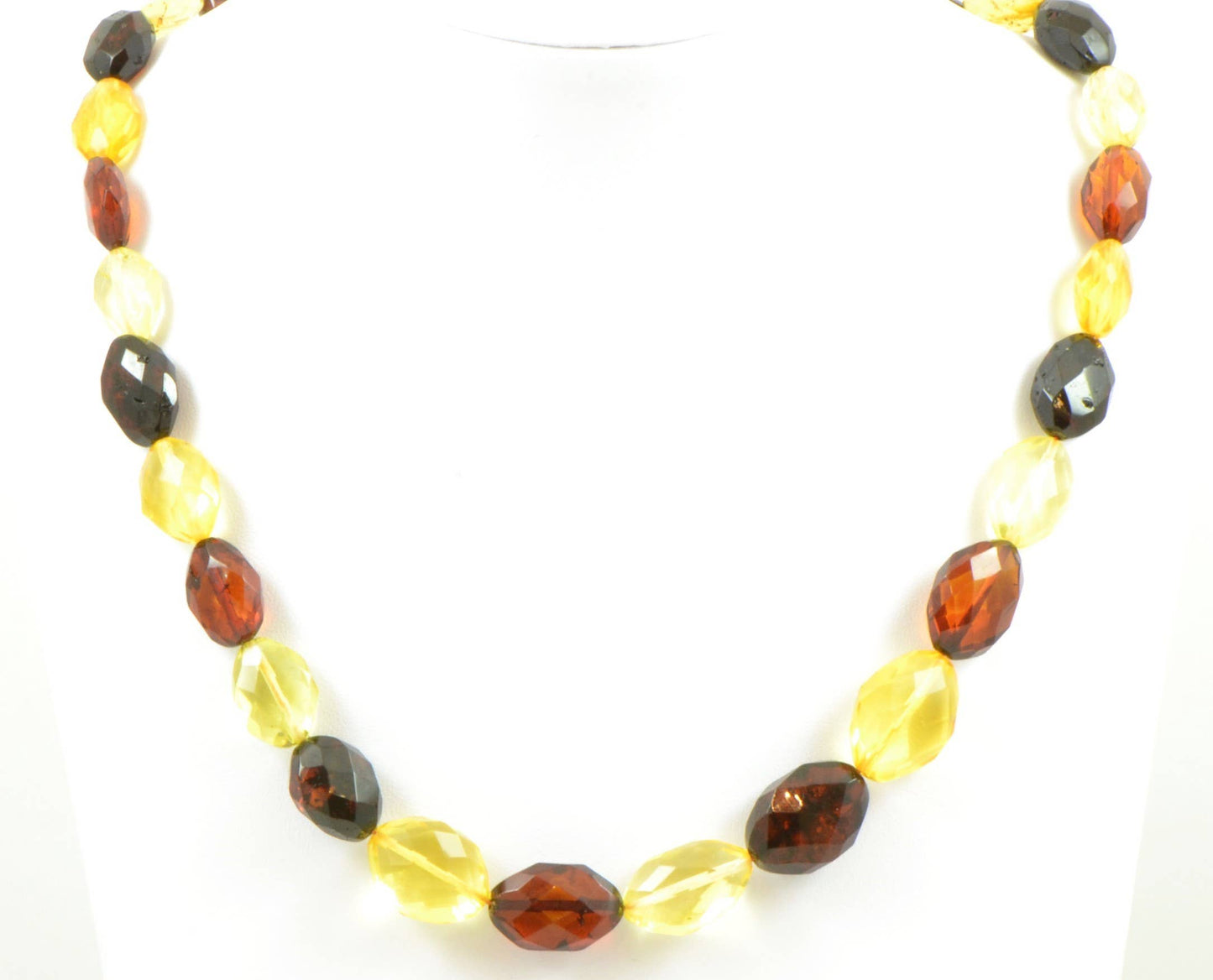 Large faceted set of multicolored amber in olive shape