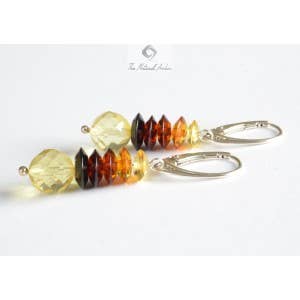 Multicolored faceted Baltic amber beads in drop shape